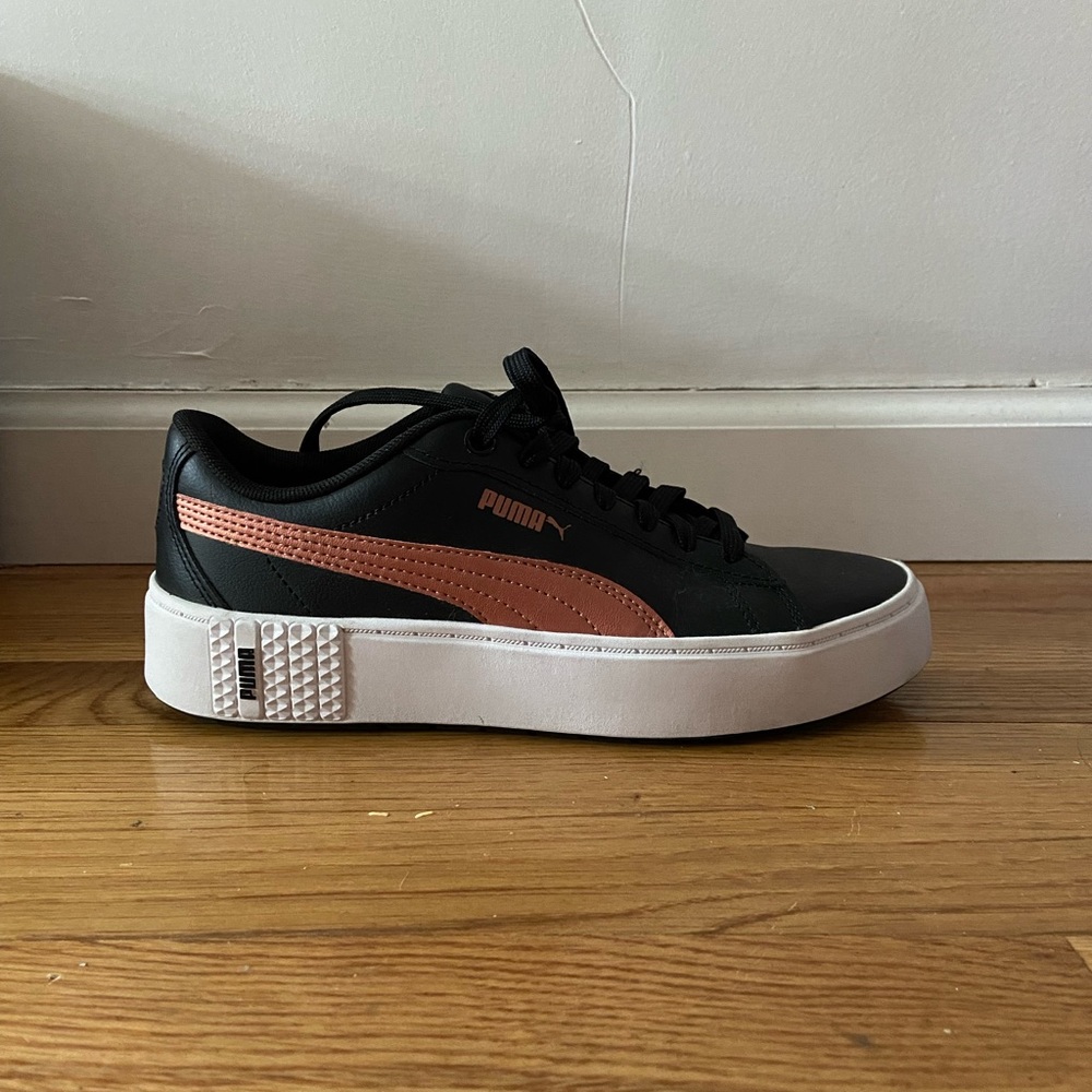 Puma size 7, black and copper leather